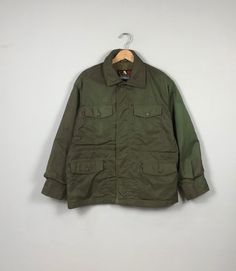 *ITEM: Vintage CAB Japanese Brand Army Field                Jacket Quilted Military Utility Parka               Jacket Windbreaker Jacket Olive Green               Size L              *ITEM DETAILS: 👇🏻 Please be aware that all vintage items will usually show a few signs of wear or fading due to age, but anything visible such as stains or holes, and serious flaws have been photographed.For any further information on this item please contact us and we will be happy to help. *SIZE: LARGE  * ACTUA Khaki Military Outerwear With Pockets, Olive Utility Outerwear With Patch Pockets, Khaki Windbreaker With Pockets For Cold Weather, Military Style Outerwear With Patch Pockets, Military Utility Jacket For Fall, Khaki Military Outerwear With Patch Pockets, Military Style Khaki Outerwear With Multiple Pockets, Military Style Long Sleeve Khaki Outerwear, Khaki Military Outerwear With Multiple Pockets