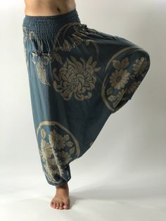 "These super soft rayon baggy unisex harem pants have the \"flow\", perfect of yoga or just a cool strolling. Comfort and character are what these pants are all about. They have the traditional sarong look & feel but a lot more practical when it comes to activity like yoga. As a bonus, they are convertible! Just pull them up and you get yourself a cute jumpsuit in a flash. Together with elastic cuff legs, you can wear them short or long. The pants have smock waist (wide bang elastic) with no Bohemian Relaxed Fit Yoga Pants, Yoga Harem Pants With Drop Crotch And Relaxed Fit, Hippie Style Harem Pants For Loungewear, Yoga Harem Pants With Drop Crotch, Relaxed Fit Drop Crotch Harem Pants For Yoga, Bohemian Relaxed Fit Harem Pants For Yoga, Blue Harem Yoga Pants, Comfortable Baggy Harem Pants For Yoga, Bohemian Harem Yoga Pants With Relaxed Fit