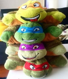 there are many stuffed animals stacked on top of each other in the shape of turtles