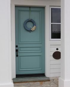 an image of a blue front door with the name alexandria gorgeous front door, color is shewn williams dixie