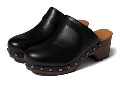 Andre Assous Sofia - Women's Clog Shoes : Black Stud : The Andre Assous Sofi, a faux fur-lined leather clog, provides supreme coziness with an elevated feel. If you are between sizes, Andre Assous recommends sizing up. Water resistant fabrication. Slip-on design features closed rounded toe and open back for easy on and off. Textile lining and insole with wood platform. Wood and rubber sole. Made in Portugal. Measurements: Heel Height: 2 1 2 in Weight: 12 oz Platform Height: 3 4 in Product measur Winter Leather Mules With Cushioned Footbed, Comfortable Leather Clogs For Winter, Leather Slip-on Clogs For Winter, Comfortable Clogs With Leather Lining And Round Toe, Leather Clogs With Cushioned Footbed For Fall, Synthetic Mules With Leather Lining And Round Toe, Winter Leather Clogs With Removable Insole, Fall Synthetic Clogs With Cushioned Footbed, High Heel Sandals Platform