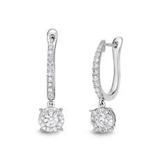 Gorgeous drop diamond earrings with a striking art deco design. Diamonds drape down the ear to a center diamond creatively framed with diamonds and white gold, making the whole look even bigger. These have a beautiful upgraded look from the traditional diamond drop earrings. Diamond Cluster Drop Earrings In Diamond White, Platinum Diamond Drop Earrings With Pave Setting, White Gold Diamond Cluster Dangle Earrings, White Gold Diamond Dangle Cluster Earrings, Diamond Drop Earrings With Pave Setting, Diamond White Single Cut Drop Earrings, Diamond White Drop Earrings With Single Cut Diamonds, Diamond Drop Earrings With Halo Design, Diamond White Drop Earrings With Halo Design