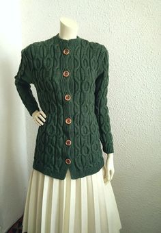 80s-90s cable knit cardigan, long spring jacket, big buttons pullover, dusted green sweater, aran fisherman style, handknitted long cardigan. GOOD VINTAGE CONDITION BUT THE SWEATER IS NOT DRY CLEAN. Measurements laying flat : shoulders 43 cm (17inches) armpit to armpit :46 cm (18 inches) total lenght :76 cm (30 inches) sleeve lenght :59 cm (23 inches) Green Cable Knit Long Sleeve Sweater Coat, Green Long Sleeve Cable Knit Sweater Coat, Green Cable Knit Sweater Coat With Long Sleeves, Winter Green Cable Knit Cardigan, Green Cable Knit Sweater Coat, Vintage Cable Knit Outerwear For Fall, Cozy Green Outerwear With Buttons, Winter Green Cable Knit Outerwear, Green Cable Knit Winter Outerwear