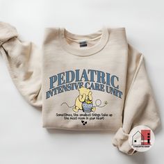 Pediatric Nurse Sweatshirt, Winnie the Pooh Pediatrics RN PEDS Nursing Sweatshirt, Cute PICU Children's Nurses Appreciation, Peds Nursing, Baby Mother Nurse, NICU Nurse Sweatshirt,  Neonatal Nurse Sweater, Wildflowers NICU Nursing Crewneck, Baby Nursery Shirt, Neonatal intensive care unit sweatshirt. * Gildan 18000 Unisex Heavy Blend Crew: Ideal for any situation, a unisex heavy blend crewneck sweatshirt is pure comfort. These garments are made from polyester and cotton. This combination helps you to come out looking fresh and beautiful. The collar is ribbed knit, so it retains its shape even after washing. There are no itchy side seams on these sweaters. * 50% cotton : -Made of specially spun fibers that make very strong and smooth fabric. * 50% Polyester : - Polyester fibers are extremel Picu Nurse Sweatshirt, Pediatric Nursing Shirts, Nursing Crewneck, Peds Nursing, Nurse Nicu, Nicu Nursing, Nursing Sweatshirt, Child Nursing, Nurse Sweater