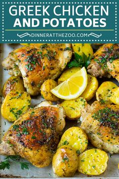 chicken and potatoes on a baking sheet with lemon wedges