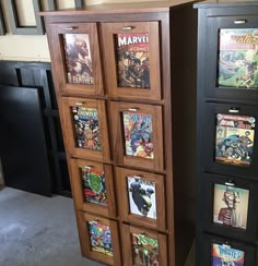 two wooden bookshelves with comic covers on them in a room next to each other