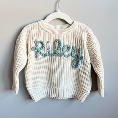 Custom hand-embroidered sweaters for your baby or toddler. Available in size newborn-big kid size 12Y! Perfect for baby shower gifts, birth announcements, gender reveals, pregnancy announcements, or keepsake gifts.  Sweaters can be customized with your child's name, phrases, and designs. Feel free to reach out if I there is something I can create for you that you don't see! RUSH MY ORDER is available! Add to your cart in addition to your sweater order. Message me for how to expedite your order. Embroidered Sweaters, Sweater Ideas, Keepsake Gifts, Gender Reveals, Kids Jumpers, Toddler Sweater, Monthly Milestone, Pregnancy Announcements, Baby Sweater