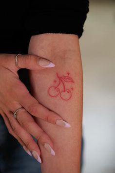 a woman's arm with a bicycle tattoo on the left side of her body