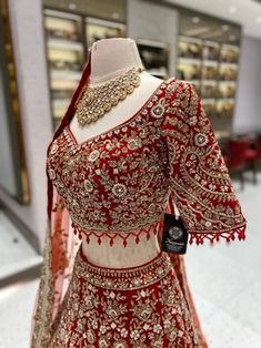 This bright red bridal lehenga BL-134 is the perfect choice for your big day. The intricate detailing of pearls, blush pink and gold stones adds a touch of elegance to the traditional design. Expertly crafted, this lehenga is sure to make you stand out and shine on your special day! Fabric: Velvet! WASH CARE INSTRUCTIONS - Please Dry clean only when it is applicable! Ready to Ship! Elegant Red Lehenga With Dupatta, Elegant Red Lehenga With Pallu, Elegant Red Kundan Traditional Wear, Bollywood Style Red Lehenga With Stone Work, Traditional Floor-length Lehenga With Stone Work, Red Kundan Set With Stone Work, Red Kundan Traditional Wear With Stone Work, Red Elegant Traditional Wear, Traditional Gown With Stone Work For Designer Wear