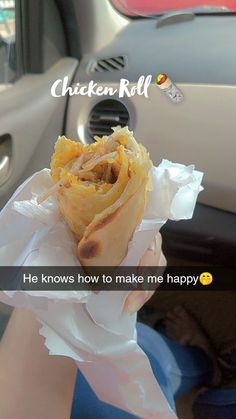 a person holding food in their hand with the caption chicken roll he knows how to make me happy