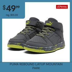 a pair of gray and yellow shoes with the words puma rebond layp mountain park