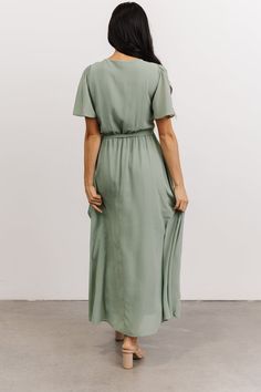 Our Waverly Wrap Dress is waiting for you! With a true wrap silhouette, high-low tulip skirt, and gorgeous movement, you'll feel beautiful! Solid Color Flowy Midi Dress With Flutter Sleeves, Feminine Flowy Wrap Dress With Surplice Neckline, Spring Bridesmaid Midi Dress With Surplice Neckline, Solid Maxi Dress With Tie Waist And Short Sleeves, Spring Chiffon Wrap Dress Maxi Length, Flowy Chiffon Wrap Dress, Solid Flowy Maxi Dress With Flutter Sleeves, Summer Chiffon Wrap Dress With Surplice Neckline, Flowy Maxi Dress With Flutter Sleeves