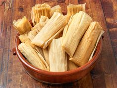 tamales in a bowl on a wooden table