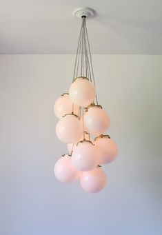 a chandelier hanging from the ceiling in a room