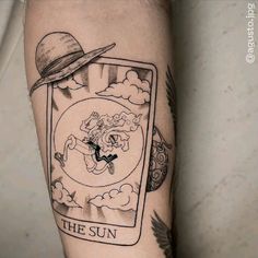 the sun tarot card tattoo on the arm