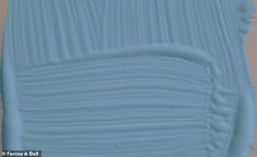 a close up view of the wood grains on a piece of blue painted furniture