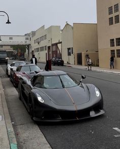 a row of cars parked on the side of a road