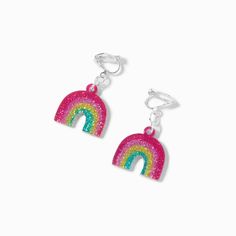 Make a statement while wearing this pair of earrings! The dainty drops feature a glitter rainbow charm hanging from each earring. Plus, they're clip-ons, so you don't need to have your ears pierced to wear them! Finish: Silver-toneDrop: 1 in. / 2.54 cm.Closure: Clip onMaterial: Acrylic - Claire's Glitter Rainbow 1'' Clip-On Drop Earrings Dance Shirts Ideas, Claires Earrings, Rainbow Nail Art, Rainbow Nail, Ears Pierced, Piercing Kit, Glitter Rainbow, Kawaii Earrings, Quirky Earrings