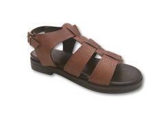 Step into style with the Vera combat platform sandal. This bold and trendy oobash sandal features a unique combat-inspired design, perfect for adding some edge to any outfit. With a comfortable footbed, these sandals will elevate your look while keeping you comfortable all day long. Features: Combat design Cushioned footbed Adjustable buckle Composition: Upper - 100% Leather Lining - 100% Leather Sock - 100% Leather Outsole - 100% Rubber Trendy Strapped Sandals For Summer, Trendy Leather Wedge Sandals With Textured Sole, Trendy Sandals With Textured Sole And Flat Heel, Trendy Brown Footbed Sandals With Removable Insole, Trendy Brown Leather Footbed Sandals, Trendy Leather Sandals With Textured Footbed, Trendy Open Toe Sandals With Textured Sole, Trendy Leather Footbed Sandals, Modern Round Toe Sandals For Vacation