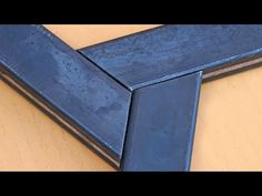 a blue frame sitting on top of a wooden table