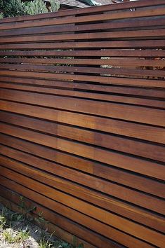 a wooden fence with vertical slats on it