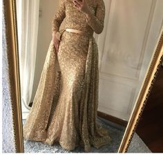 When you're looking for a beautiful dress that is both elegant and stylish, you'll find no better option than the Muslim Gold Mermaid dress. This exquisite evening gown is made of luxurious, shimmering satin and features a long train with a delicate train. It's perfect for proms, weddings, or other formal occasions. Muslim Gold Mermaid dress is an amazing evening dress for Muslim woman, it is sweeping and silky, sparkling and long, when you wear it for to a party, the whole people will turn to look at you. This dress is suitable for any occasion such as party, prom night, show, evening out. The dress made of high quality material ,beautiful design and fashionable style. Dazzle in this gold and silver mermaid evening dress for the most captivating look. This long evening gown is perfect for