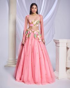 Our pink tulle lehenga is adorned with intricate patchwork embroidery and metallic accents cascading from the waist to the hips. The lehenga is embellished with scatter embroidery, featuring gold elements and delicate pink crystals throughout. Completing the ensemble is a sleeveless pink blouse featuring matching patchwork.From Papa Don’t Preach’s Bring Your Own Fairytale collection. DELIVERY TIMEPlease allow 8-12 weeks for your outfit to arrive. FABRIC DETAILSTulle Professional cleaning only. Indian Carnival Outfits, Patchwork Lehenga, Indian Carnival, Tulle Lehenga, Haldi Outfit, Patchwork Embroidery, Pink Lehenga, Fancy Dress Design, Pink Tulle