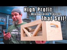 a man holding a wooden box with the words high profits woodworking projects that sell