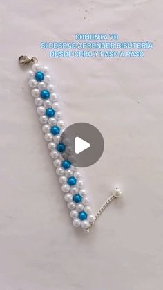 a white and blue beaded bracelet with beads