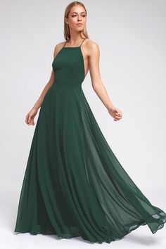 a woman in a long green dress