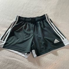 Adidas Jogging Shorts. Brand New Condition. Dark Gray With White Stripes On Sides And White Border On The Back Bottom. Drawstring At Elastic Waist. Please See Pictures For Measurements. White Stretch Shorts With Three Stripes, Adidas Sports Shorts With Side Stripes, Adidas White Gym Shorts, Green Stretch Adidas Bottoms, White Three Stripes Short Activewear, Adidas Green Sporty Shorts, Green Sportswear Bottoms With Three Stripes, Adidas Sporty Green Shorts, Sporty Green Adidas Shorts