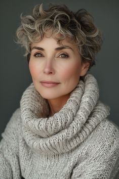 Opt for a curly pixie cut to inject fun and texture into your look. Ideal for women over 50, this hairstyle is both fashionable and manageable, allowing for a playful yet elegant appearance. Click here to explore more inspiring hairstyles that fuse classic elegance with contemporary flair. Curly Pixie Cut, Curly Pixie Cuts, Curly Pixie