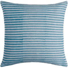 a blue and white striped pillow on a white background