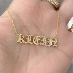 This unique personalized Old English font nameplate cut-out necklace is composed of 14K solid gold and beautifully pavé set with genuine GVs1 quality natural real Diamonds. This pendant is complemented by a durable 14K solid gold adjustable chain or can be purchased as a charm alone without the chain under the "Length" drop-down menu. NOTE: The item will be made in the exact casing of the characters entered. Please be mindful of this detail when providing the customization desired. Name Dimensio Gold Engraved Diamond Custom Necklace, Custom Gold Engraved Diamond Necklace, Custom Engraved Diamond Necklace In Gold, Custom Engraved Gold Diamond Necklace, Luxury Gold Nameplate Necklace, Luxury White Gold Pendant Name Necklace, Luxury Gold Custom Name Necklace, Customized Yellow Gold Luxury Necklace, Luxury Customized Yellow Gold Necklaces