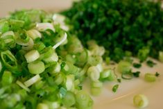 chopped up green onions on a white plate