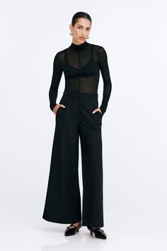 Claremont does all the legwork to keep your Monday-Sunday wardrobe polished. These relaxed wide-leg pants are fashioned from structured European ponte with a fly-front zipper and a wide waistband that rests comfortably at the mid-waist. Finished with functional pockets and a tuxedo panel to accentuate her clean lines. | Astrid, in black and in mist, is 5'9" (175 cm) tall, wearing size XS. Sejal, in black, is 5'8" (173 cm) tall, wearing size M. Approximately 39.5" (10.5 cm) from below the belt. Inseam is approximately 30" (76 cm). European Ponte, also known as Punto di Roma (60% Viscose, 30% Polyamide, 10% Lycra).Machine wash on delicate cycle, or hand wash in cold water. Tumble dry on low heat, or for best results, lay flat to dry. Designed in NYC. Handcrafted in Europe. | Marcella Claremo Leg Work, Wide Waistband, Pants Outfit, Clean Lines, Front Zipper, Denim Dress, Lay Flat, Leg Pants, Black Pants