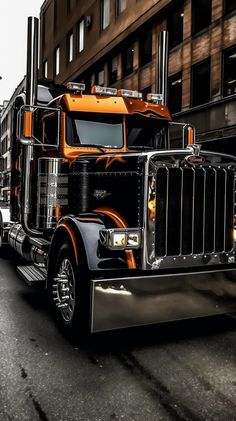 a large semi truck driving down a city street