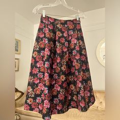 Stunning 70s Style Midi Skirt Brand New With Tag!!! Stretchy Thick Material With A Hidden Side Zipper! Amazing Quality And Detail Approximate Measurements When Laying Flat Are As Follows (Unstretched): Length - 12” Waist - 26” Pink A-line Bottoms For Party, Pink A-line Party Bottoms, Pink A-line Maxi Skirt For Party, Floral Print Full Maxi Skirt For Party, Pink Floral Print Maxi Skirt For Party, Floral Print Flared Skirt For Party, Floral Print Full Skirt For Party, Style Midi Skirt, Floral Midi Skirt