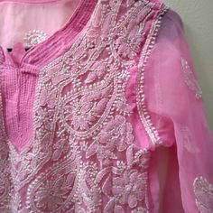 Beautiful Pink Hand Embroidered Sheer Top In Size Medium. Embroidery Done On The Full Front And Hem Of The Sleeves. Never Worn Without Any Brand And Size Tag. Cheap Resham Embroidery Blouse Piece For Eid, Embroidered Pink Top For Eid, Pink Embroidered Top For Eid, Pink Floral Embroidered Tops For Eid, Festive Pink Tops With Chikankari Embroidery, Pink Chikankari Embroidery Blouse For Eid, Pink Chikankari Embroidered Blouse For Eid, Pink Blouse With Chikankari Embroidery For Festivals, Summer Chikankari Embroidery Fabric