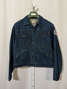 Madewell Vintage 1950s Denim Workwear Pleated Jacket Volkswagen 40 USA. Very rare jacket. Embossed snap buttons. Indigo heavy denim with unique design. Volkswagen and blue feet patches. Great vintage condition. Pit to pit: 20" Length: 21" Shoulders: 18" Shoulder to cuff: 24" Retro Outerwear With Patch Pockets In Medium Wash, Retro Denim Blue Denim Jacket With Pockets, Vintage Selvedge Denim Jacket For Fall, Retro Cotton Denim Jacket For Workwear, Vintage Cotton Denim Jacket With Pockets, Vintage Fitted Denim Jacket With Patch Pockets, Vintage Blue Denim Jacket With Patch Pockets, Vintage Blue Denim Jacket With Pockets, Vintage Dark Wash Denim Jacket