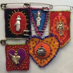 These religious and spiritual icons and charms would be perfect additions to a pocket shrine. Flag Pins, Textile Jewelry, Embroidery Inspiration, Fabric Jewelry, Fabric Art, Felt Crafts, Embroidery Art, Textile Art, Fabric Crafts