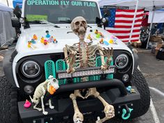 a jeep with skeleton decorations on the front