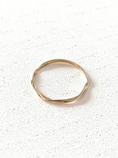 9k Solid Gold Ring width 1mm *Jewellery box included This piece is a minimalist beauty. It is solid gold and has quickly become a favourite in our collection. Our Solid Gold Twist Ring is the perfect gift for yourself or someone special that will stand the test of time. The solid gold boho ring is timeless and although dainty is good quality. It is delicate, very minimalist looking and makes the perfect statement. These items are fine pieces of jewellery, so please refer to taking care of your item with care. For example removing when sleeping, brushing hair, exercising etc.  We do not offer replacement, repair or exchange for any of our pieces. So please keep in mind this is a delicate/fine piece of jewellery. Jewellery | Personalised | Classic | Gift idea | Solid gold | jewelry | Real Go Minimalist 14k Gold Stackable Rings Gift, Simple Stackable Jewelry In Recycled Gold, Simple Stackable Recycled Gold Jewelry, Simple Yellow Gold Stackable Rings As Gift, Hypoallergenic 14k Yellow Gold Midi Rings, Simple Hypoallergenic 14k Gold Jewelry, Minimalist 14k Gold Midi Rings, Minimalist Gold Stackable Rings With Diamond Cut, Gold Minimalist Stackable Rings With Diamond Cut