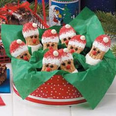 there are many cookies in the shape of santa hats