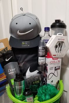 a green basket filled with sports items on top of a counter