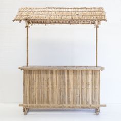 a bamboo stand with a roof on top