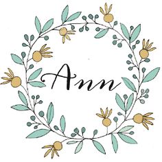 the word ann surrounded by flowers and leaves in a circle with an inscription underneath it