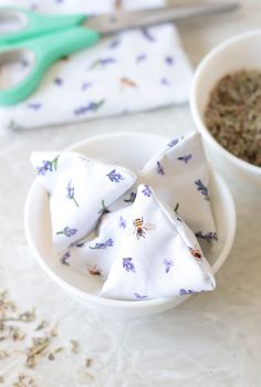 a white bowl filled with oatmeal next to a spoon and napkin on top of a table