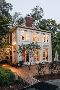 a large white house with lots of windows