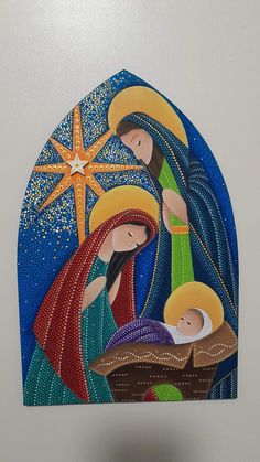 the nativity scene is depicted in this hand painted tile wall hanging ornament